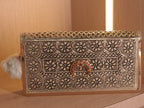 Straight on view of the clutch wallet face, with the gold accent running along the border of the flap.