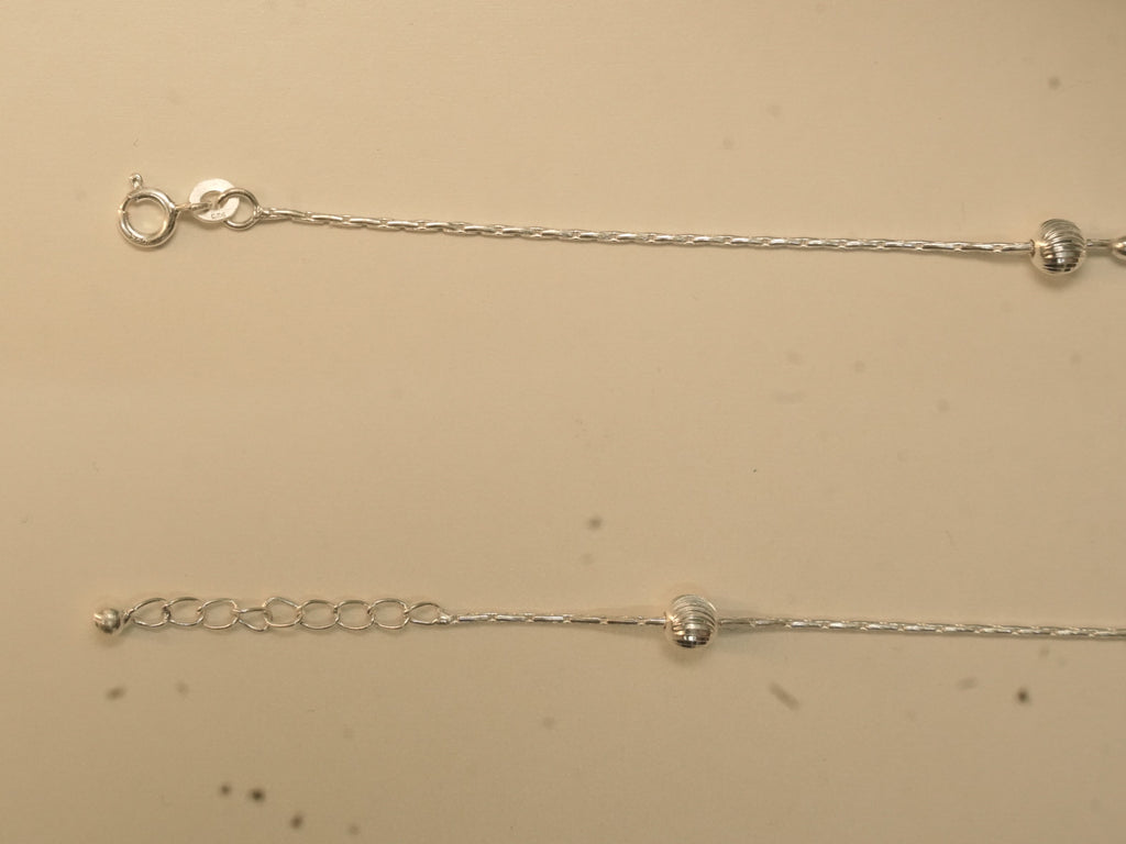 Spring ring clasp and extender chain on the heart and heel payal.