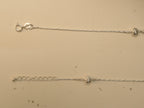 Spring ring clasp and extender chain on the heart and heel payal.