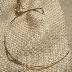 Full view of the fine mixed-tone anklet showing its silver, gold-tone and rose gold-tone strands and end cap.