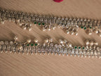 Section of the oxidised silver payal with leaf drops and ghungroos hanging from the lower edge.