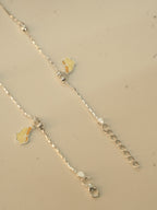 Clasp end of the butterfly payal, showing the lobster clasp and the extender chain.