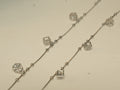 Pair of silver payal with open cube charms, each holding an American Diamond, on a box chain with bead stations.