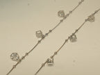 Pair of silver payal with open cube charms, each holding an American Diamond, on a box chain with bead stations.