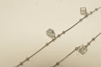 Close view of the cube charms and polished bead stations on the silver payal.