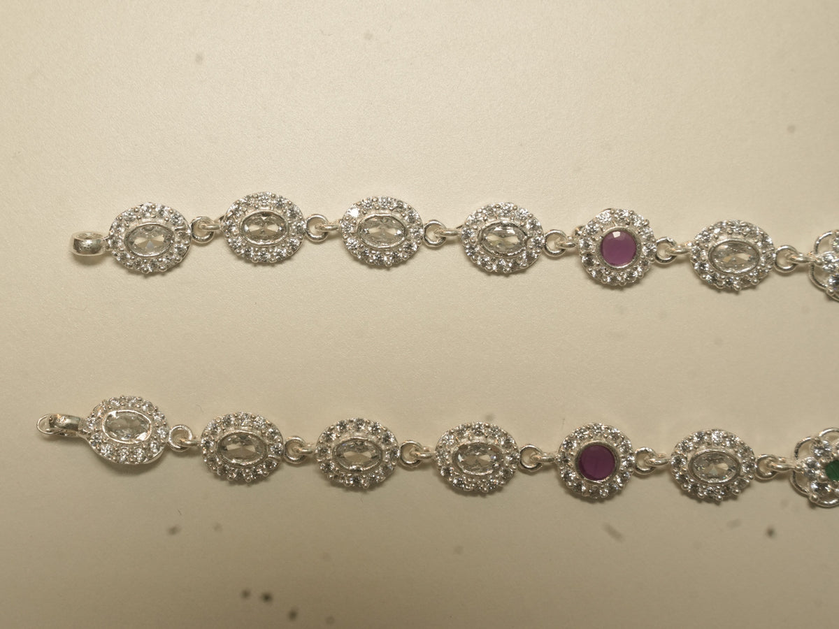 Pair of sterling silver payal made of oval halo links, with a deep pink stone link on each.