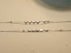 The pair of five heart payal laid out to show both strands and the bead stations.