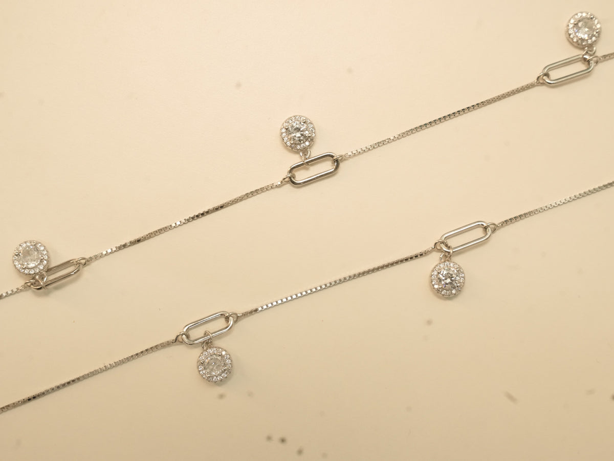 Pair of silver payal with paperclip links, each link carrying a round American Diamond halo drop.