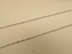 Close view of the alternating bars and round beads on the silver payal.