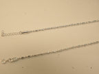 Spring ring clasp and extender chain on the bar and bead payal.