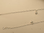 Spring ring clasp, extender chain and puffed heart charms on the figaro chain payal.