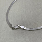 Close-up of the herringbone links and lobster clasp of the payal pair.