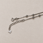 The spring ring clasp, extender chain and heart tag of the American Diamond drop anklet.