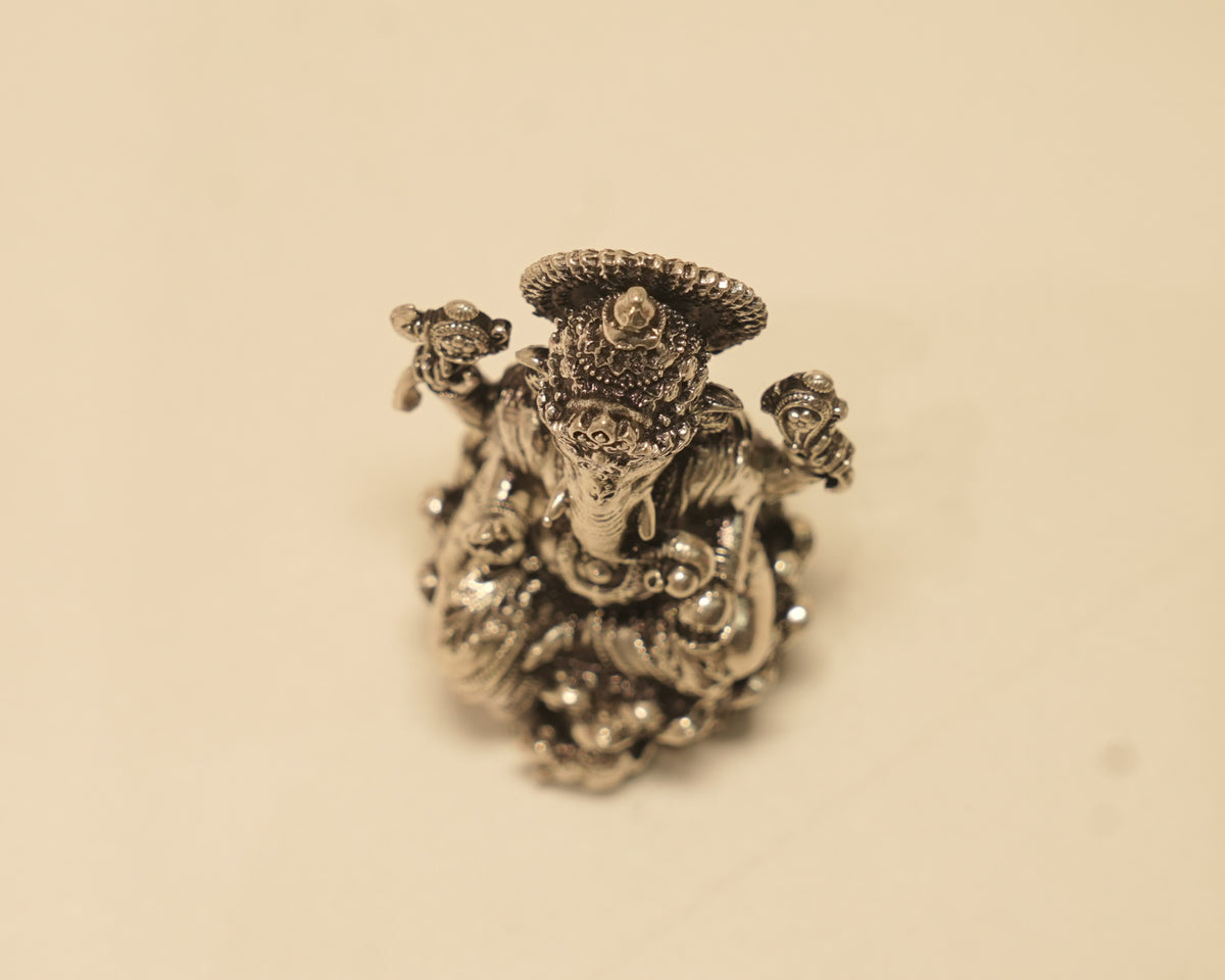 Looking down on the antique silver Ganesh idol from above.