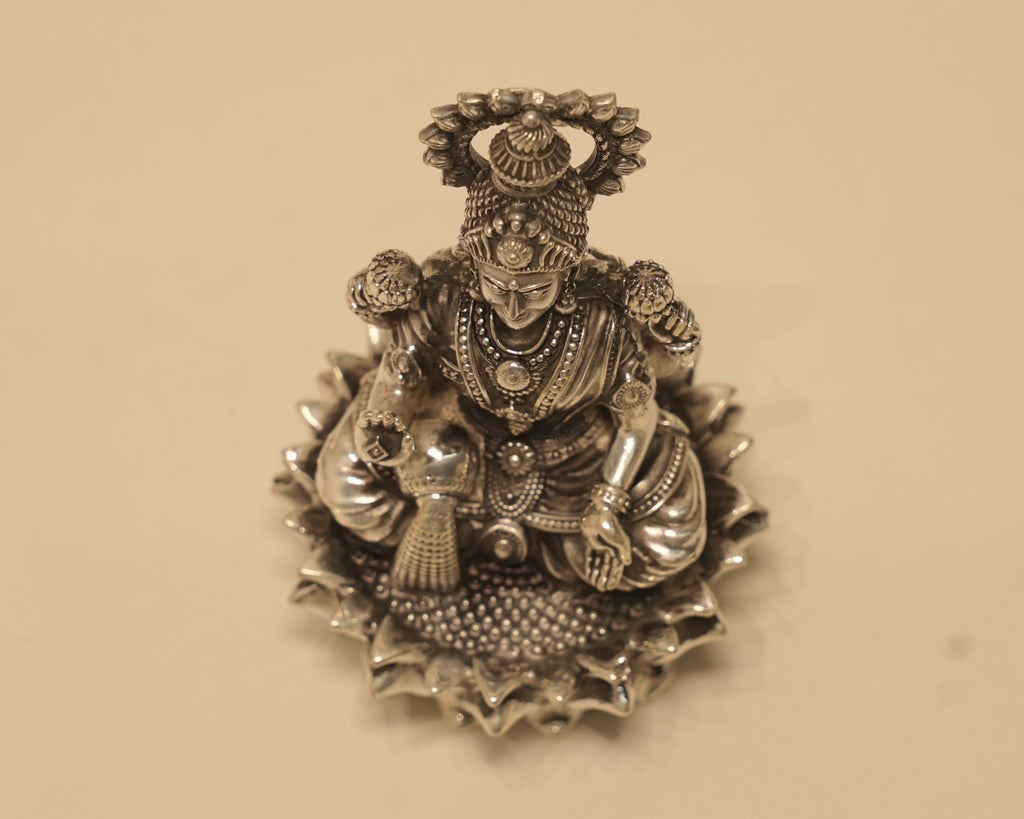 Looking down on the large silver Lakshmi idol from above.