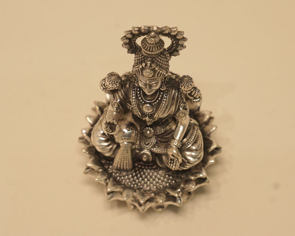 Looking down on the large silver Lakshmi idol from above.