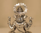Close view of the back of the large silver Ganesh idol, showing the flowers worked into the dhoti.
