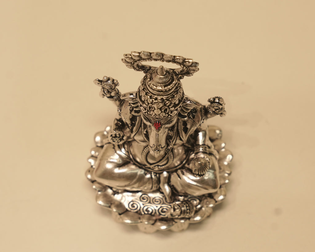 Looking down on the large silver Ganesh idol from above.