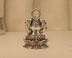 Back of the antique silver Ganesh idol, showing the plain round disc behind the crown.