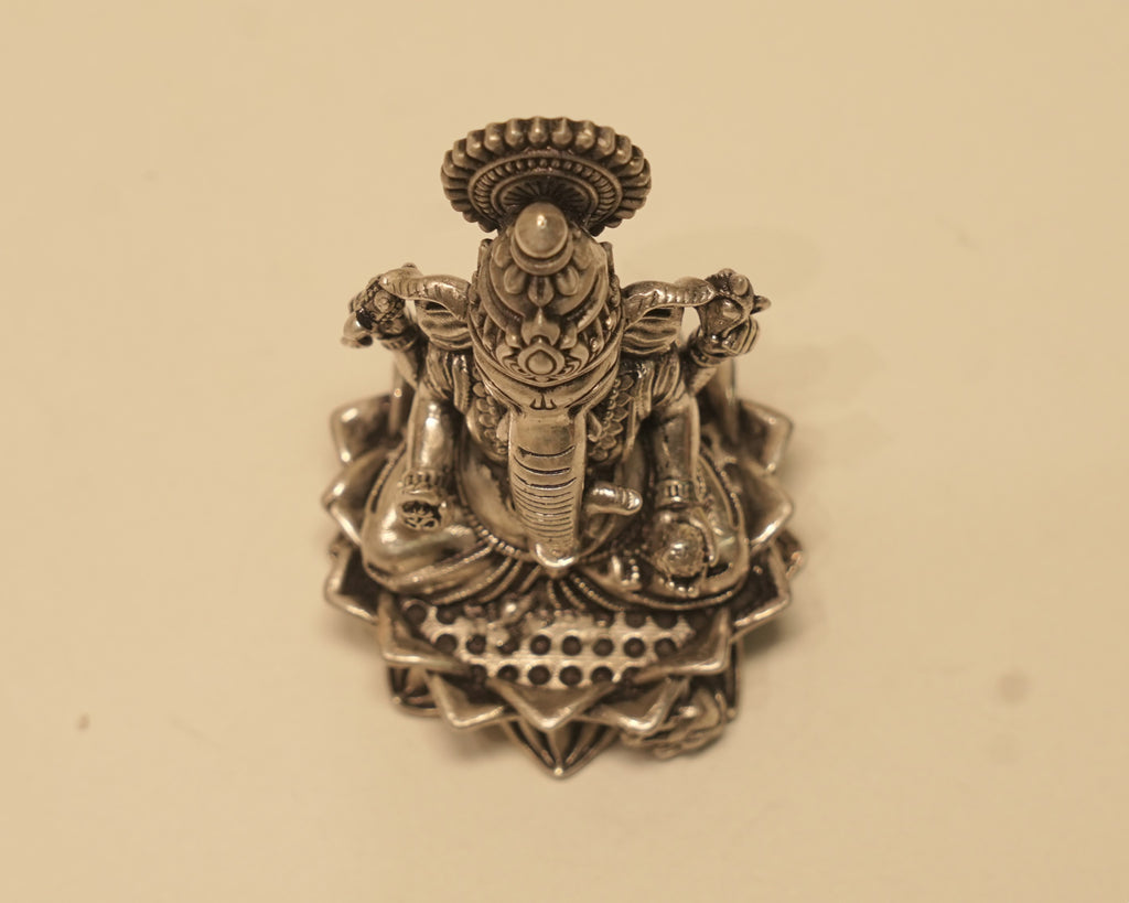 Looking down on the antique silver Ganesh idol from above.