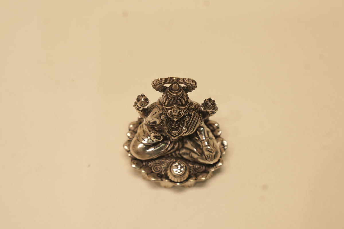 Looking down on the silver Lakshmi idol from above.