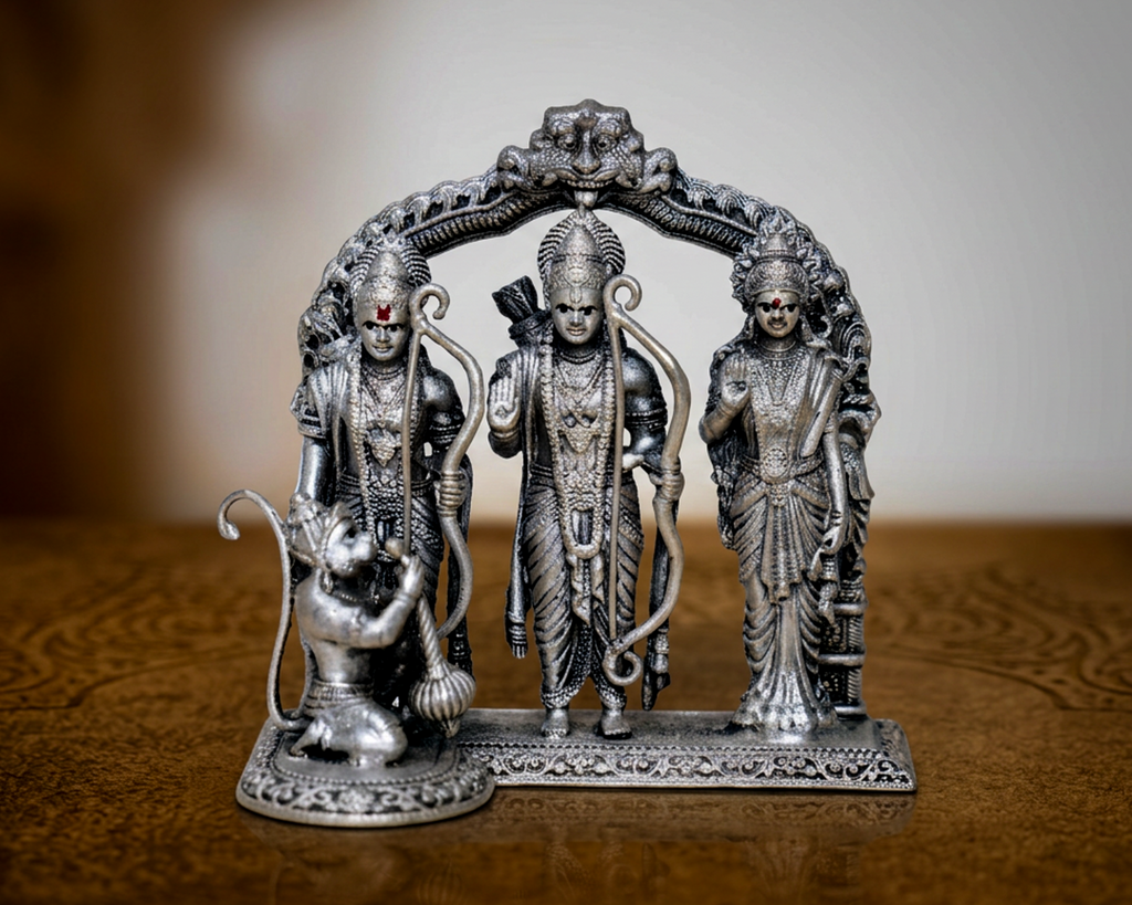 Antique finish sterling silver Ram Darbar with Ram, Sita and Lakshman under a carved arch and Hanuman kneeling in front.