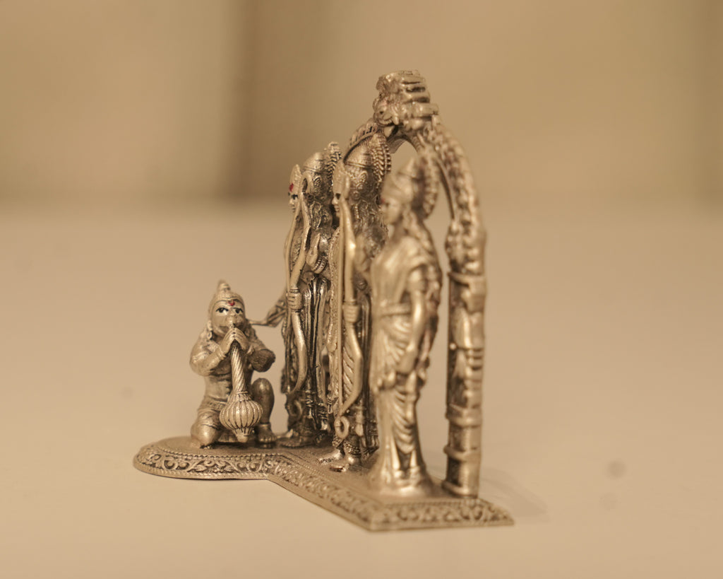 Angled view of the antique silver Ram Darbar, showing the depth of the arch and Hanuman at the front.