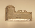 The plain back of the silver Ram Darbar arch, showing the silver mark stamped into it.