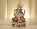 Large sterling silver Ganesh idol in a red enamel dhoti and green shawl, seated on a silver lotus base.