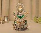 Back of the enamelled silver Ganesh idol, showing the crown set within the rayed disc.