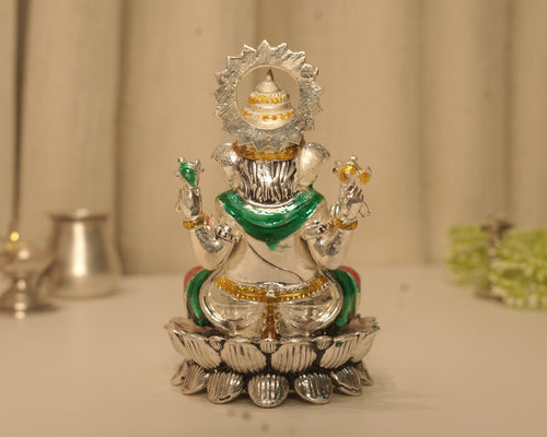 Back of the enamelled silver Ganesh idol, showing the crown set within the rayed disc.
