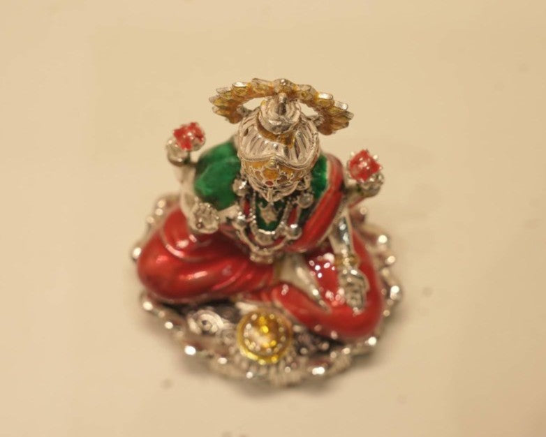 Looking down on the enamelled silver Lakshmi idol from above.