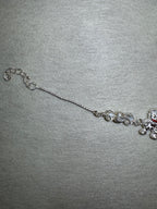 Lower half of the sterling silver charm bracelet, showing the second bead station and the extender chain.