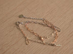 Angled view of the chain bracelet, showing the light catching the textured links.