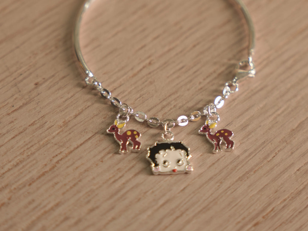 The kids charm bracelet showing the rigid band section and the hook where the chain closes.