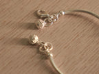 The bead station of the nazariya, with the light blue evil eye bead at its centre.
