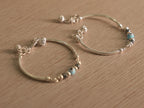 The closure rings and ghungroo drops of the baby nazariya bangle.