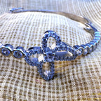 Close view of the pave set clover outline and the round centre stone.