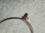 Lobster clasp and Javeri House tag on the rose-tone sterling silver snake chain necklace.