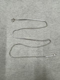 Full 45 cm length of the sterling silver chain necklace laid out on grey felt, showing snake sections alternating with runs of round beads and a spring ring clasp.
