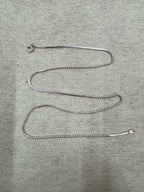Full 45 cm length of the sterling silver chain necklace laid out on grey felt, showing snake sections alternating with runs of round beads and a spring ring clasp.