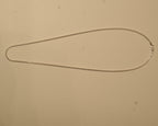 The silver snake chain laid out in a long oval to show how it falls.