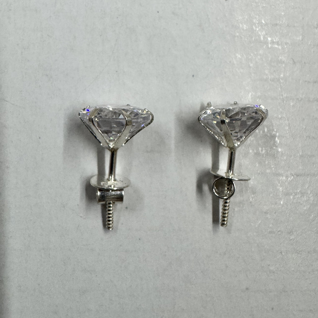 Side view of the sterling silver stud earrings, showing the tapered claw baskets, threaded posts and screw-on backs.