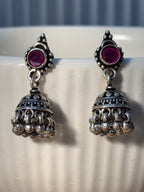Both dome styles of the oxidised pink stone jhumkas placed side by side for comparison.