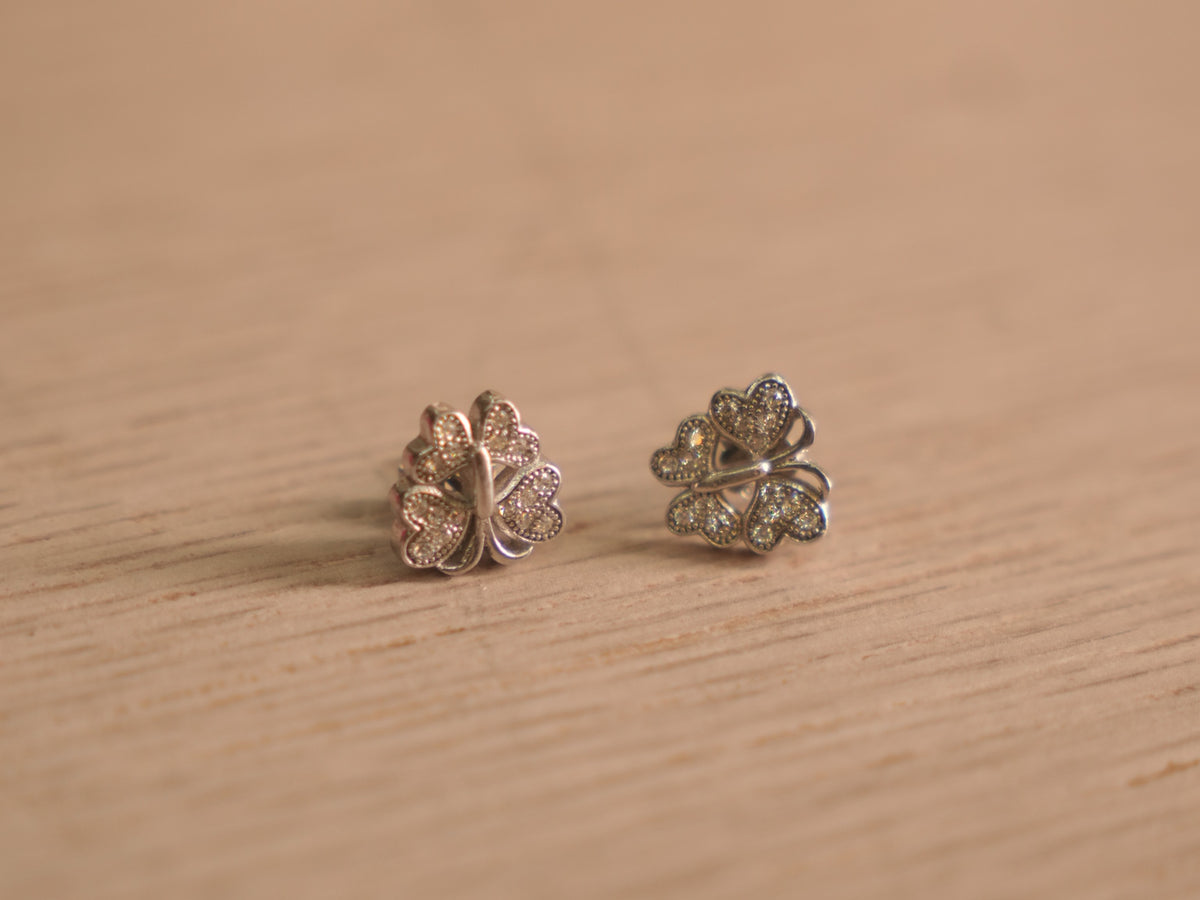 Pair of sterling silver stud earrings with pave set American Diamond butterfly wings around a centre stone.