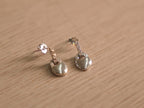 Pair of sterling silver earrings with heart shaped padlock drops traced in American Diamonds.