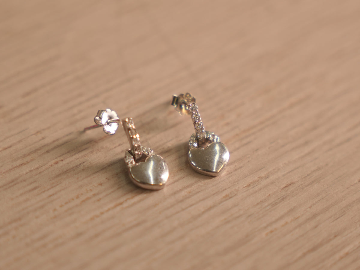Pair of sterling silver earrings with heart shaped padlock drops traced in American Diamonds.
