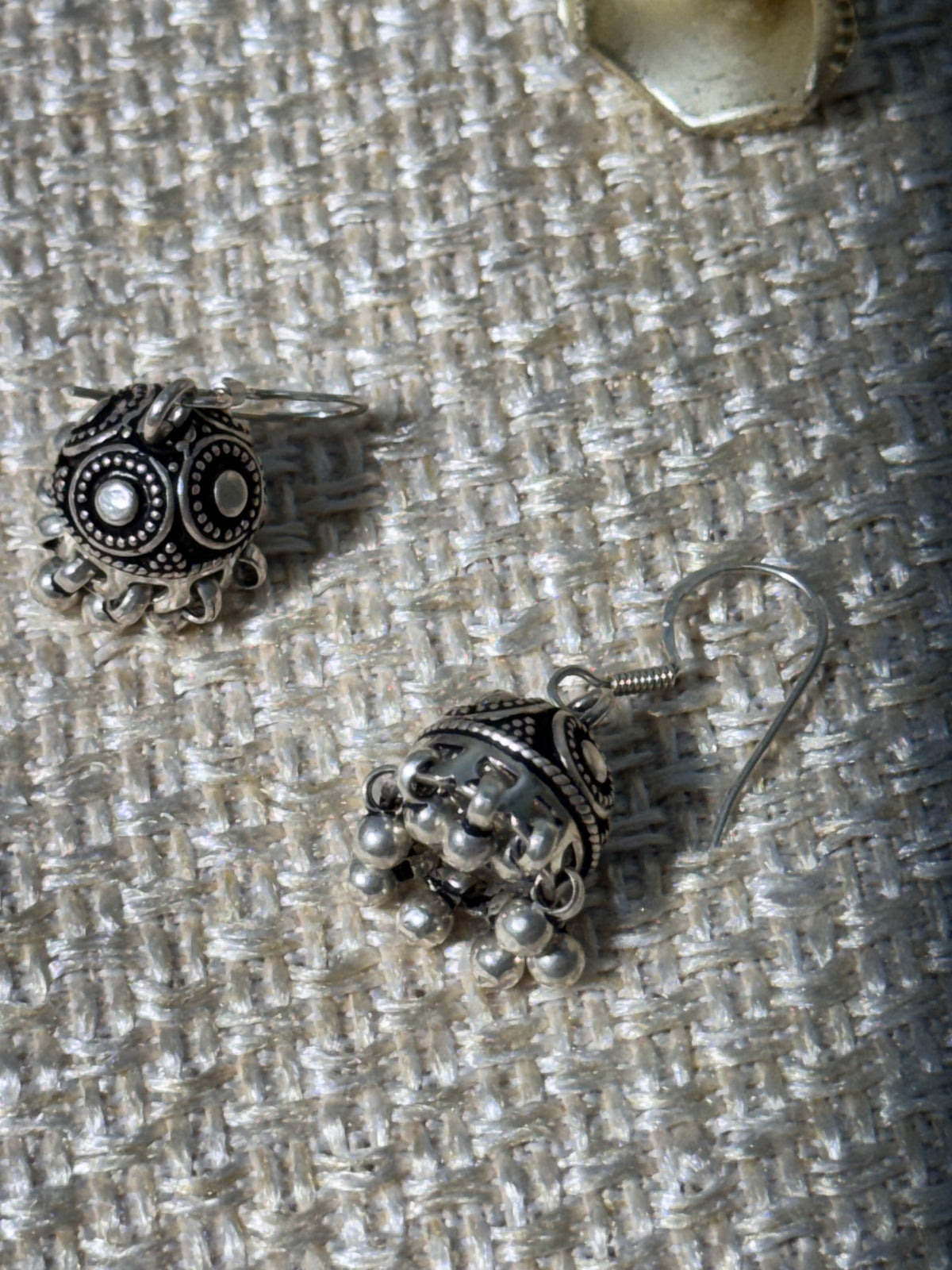 Close view of the ribbed oxidised jhumki dome and the row of ghungroo bells.