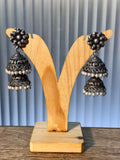 Pair of oxidised sterling silver tiered jhumkas edged with rows of small pearl drops.