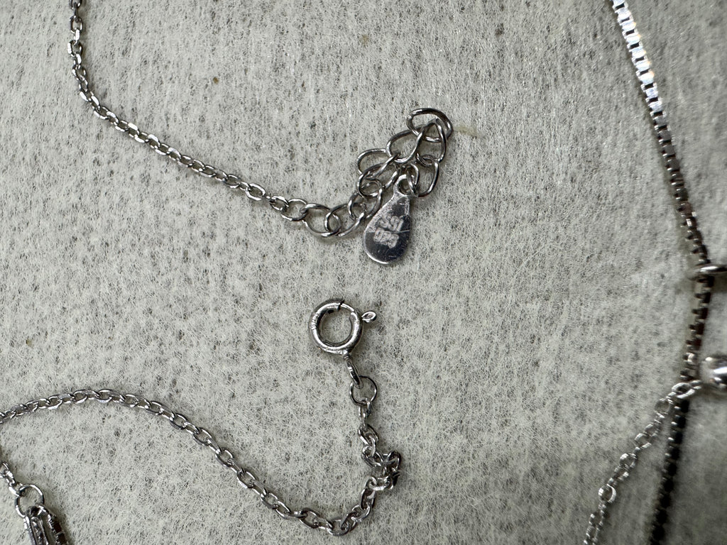 Spring ring clasp, extender chain and the Javeri House tag on the sterling silver layered necklace.